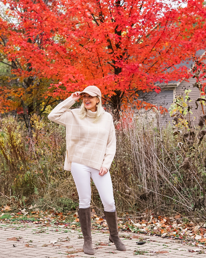 tan windowpane sweater and white denim