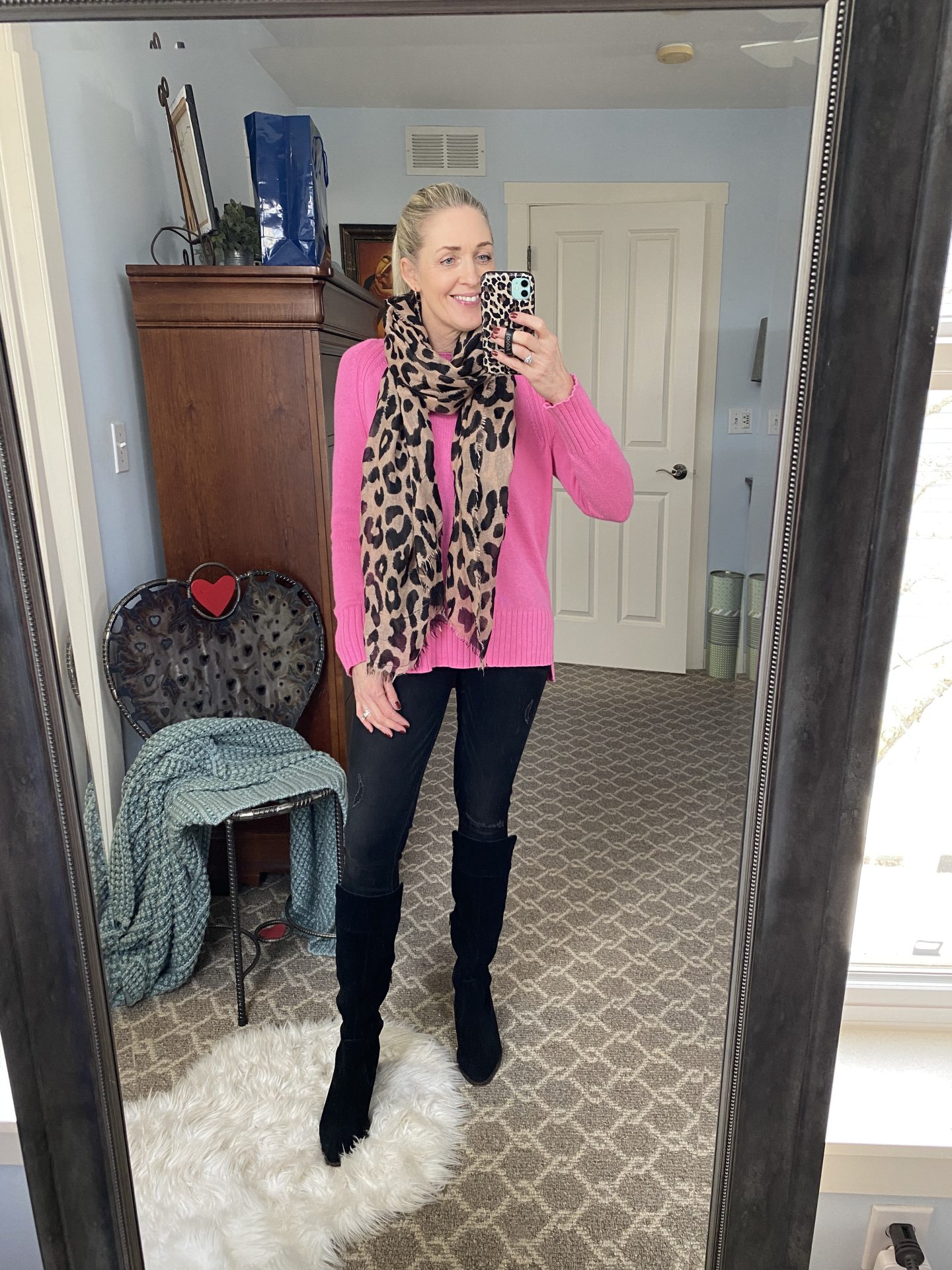 bright pink sweater and leopard scarf