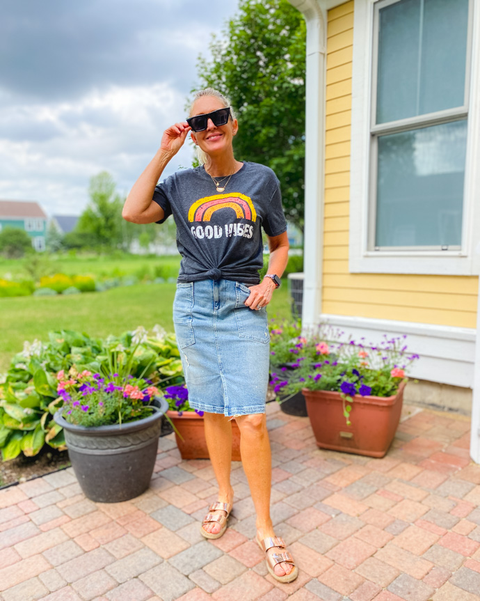 good vibes tee styled with denim skirt