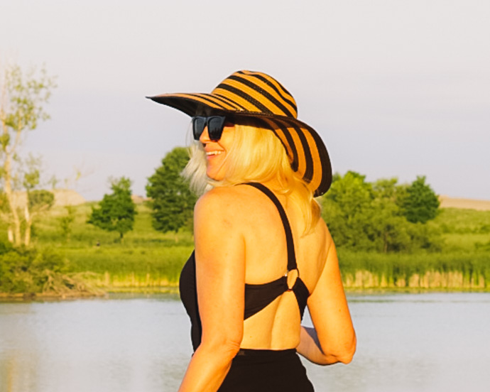 cute one shoulder swimsuit and striped straw hat