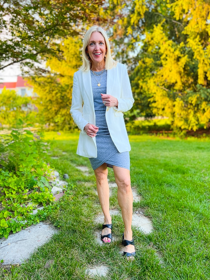 woman wearing grey dress and white blazer