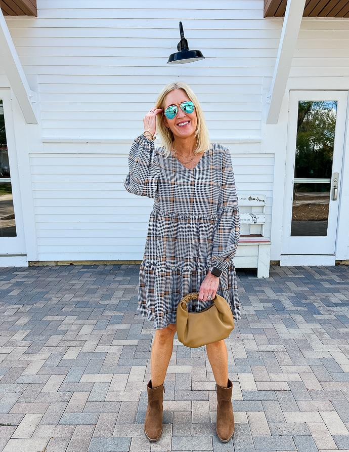 woman wearing plaid tunic dress with booties